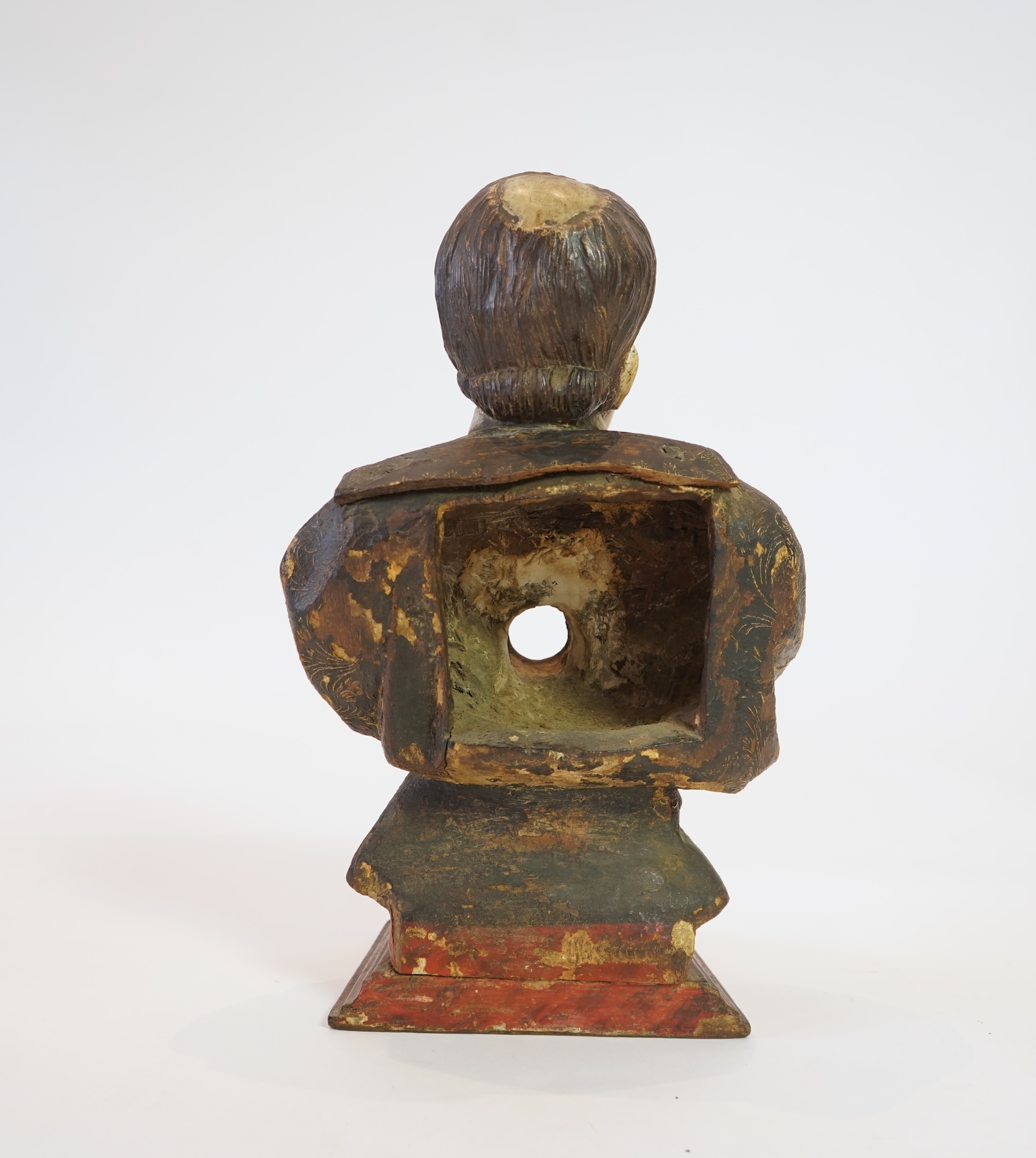 A 19th century Spanish polychrome wood bust of a Saint